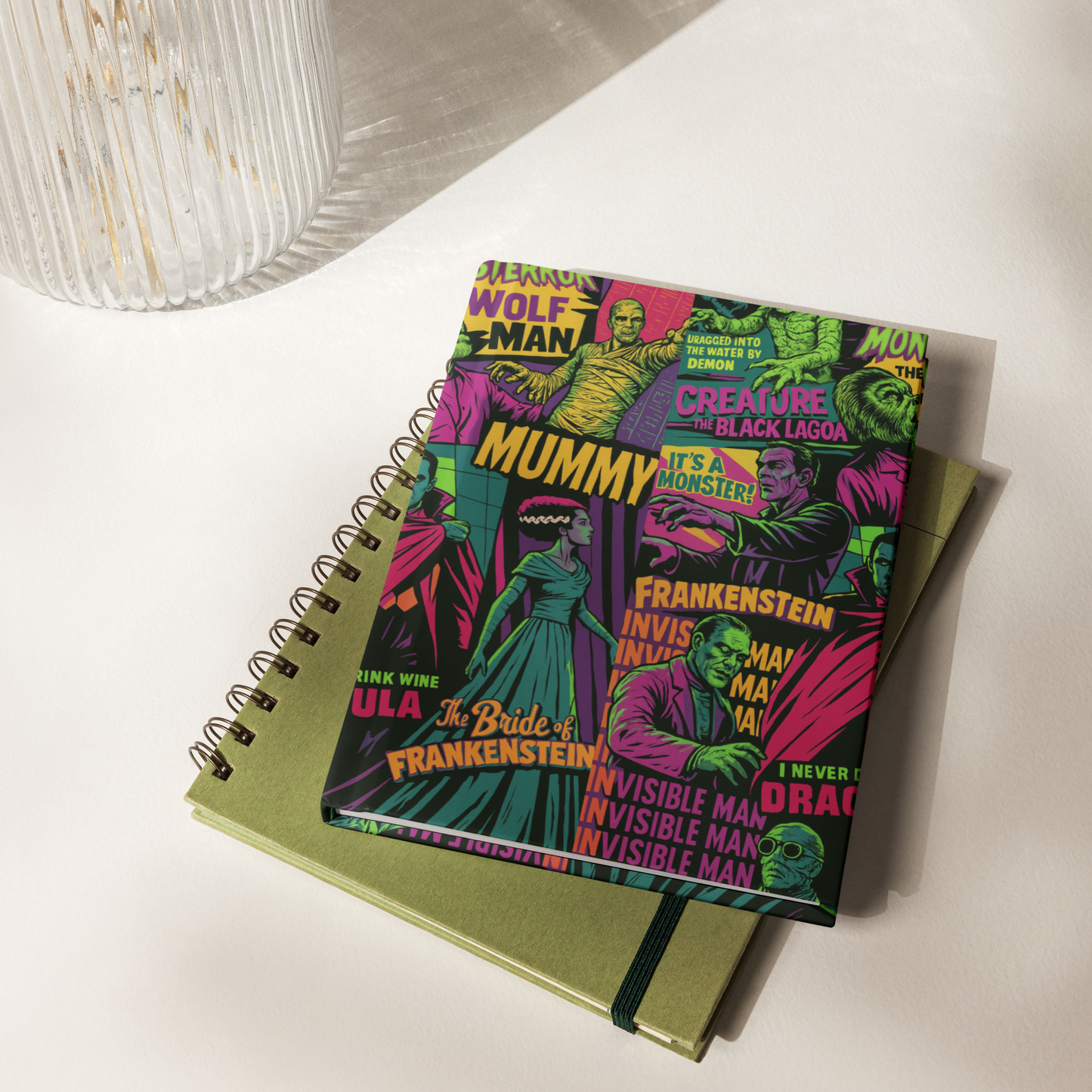 Notebook with a colorful horror-themed cover on a white surface